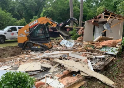 Demolition equipment clearing debris at a jobsite in Aiken SC