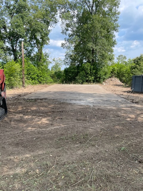 Cleared Windsor SC demolition site with the concrete pad left intact