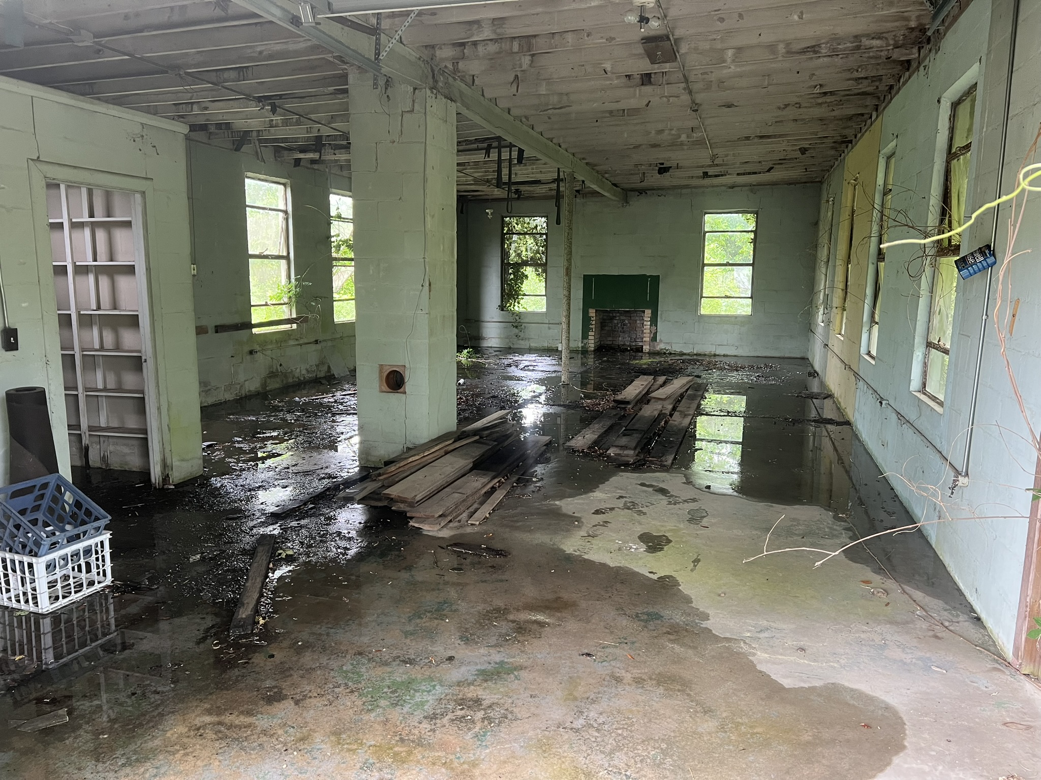 Standing water inside an old block building before demolition in Windsor SC