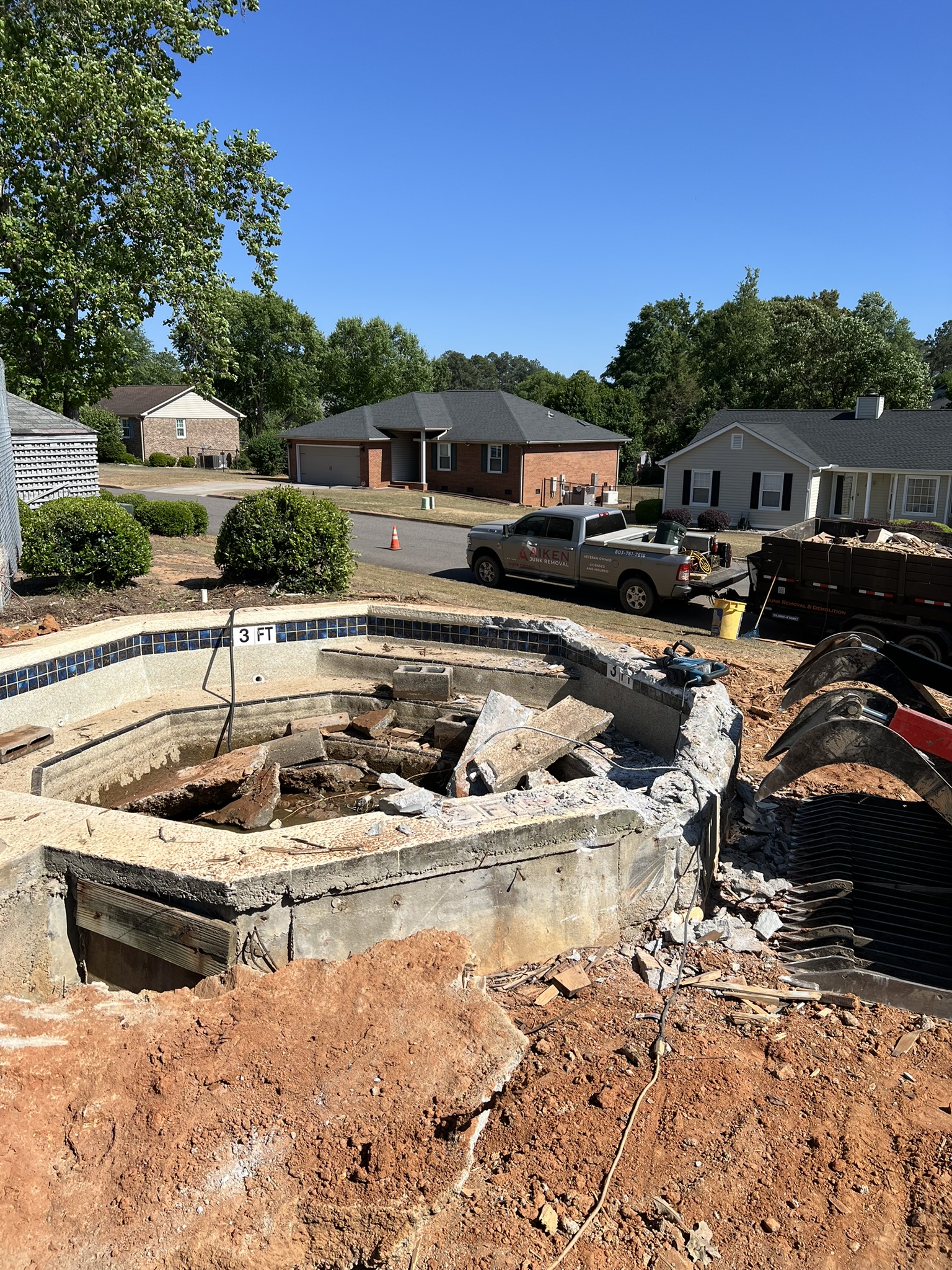 Concrete spa partially demolished during an Aiken SC deck and spa removal project
