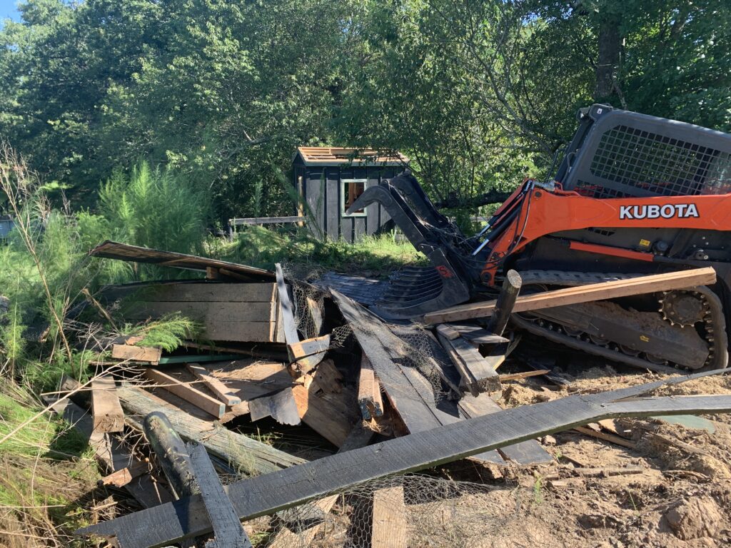 Farm outbuilding removal in Aiken South Carolina with demolition equipment