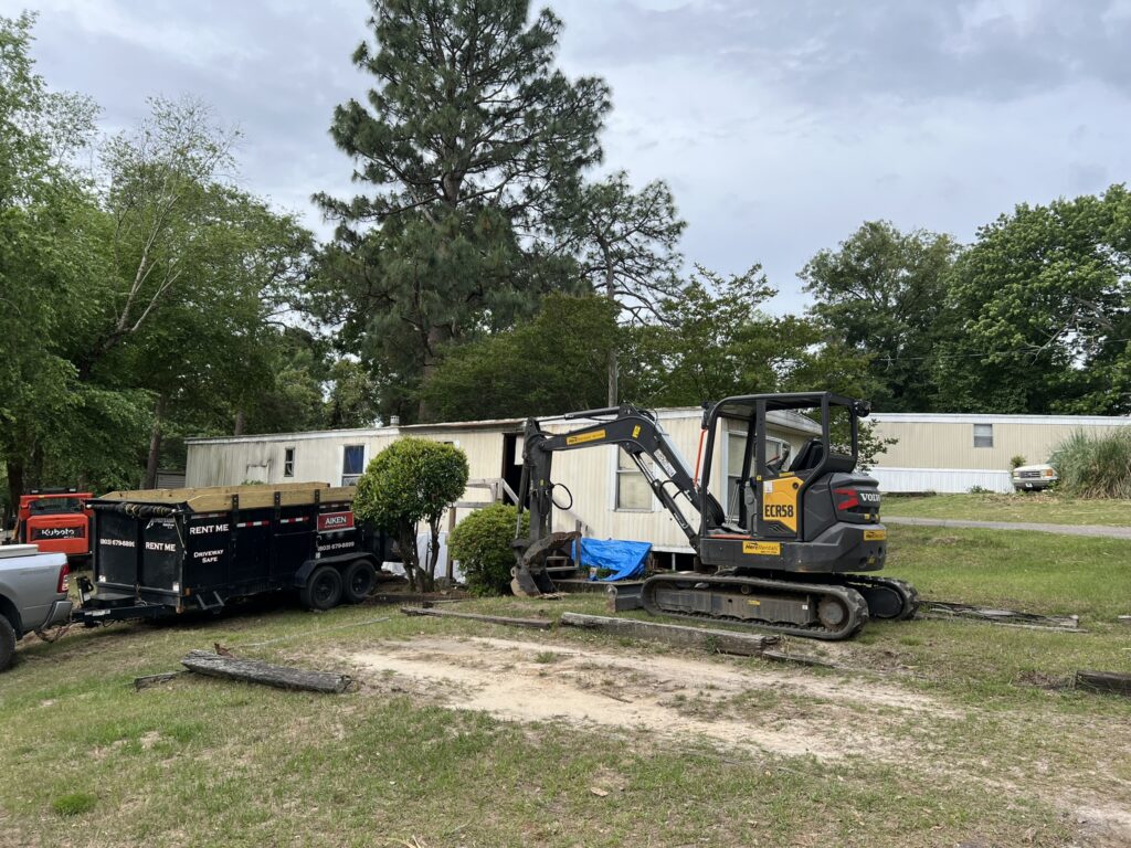 Old mobile home removal project with demolition equipment in South Carolina
