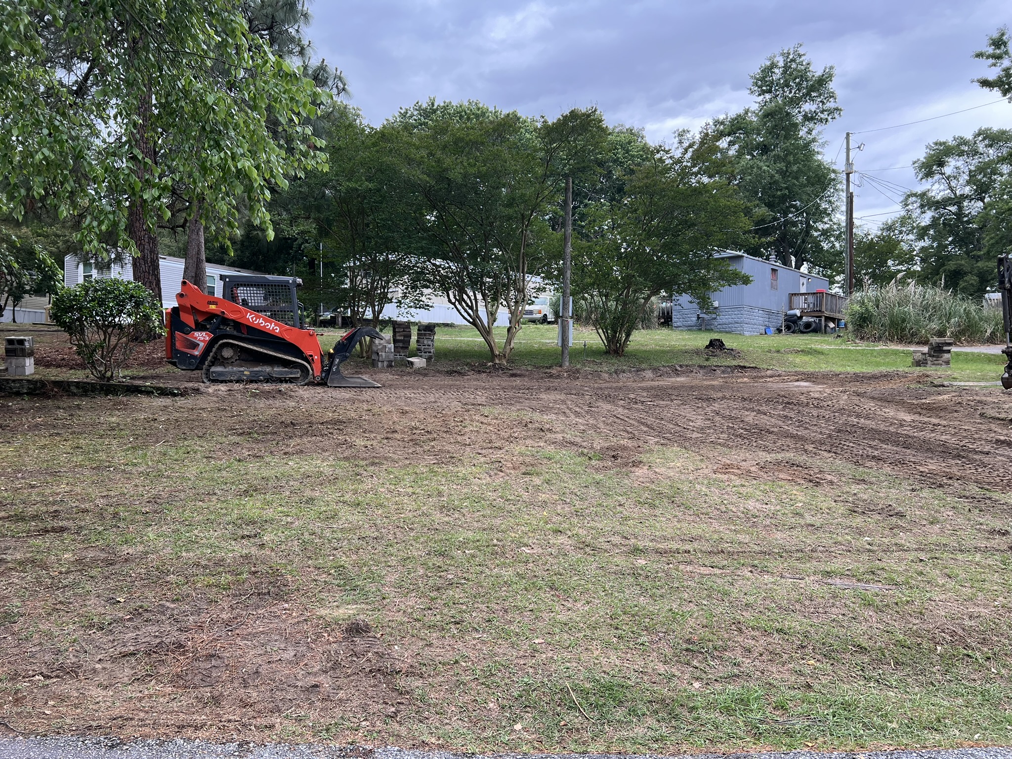 Mobile home removal site after demolition with equipment in North Augusta South Carolina